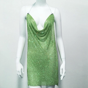 Detail of light green sequin mesh mini dress with shimmering metallic chain halter neck