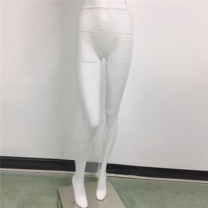 Detailed view of white mesh skirt with sparkling rhinestones for beach or stage wear