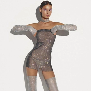 Detailed view of silver rhinestone mesh mini dress with matching sleeves and leg warmers