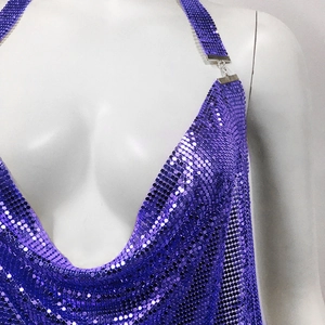 Detail of purple sequin halter top with metallic texture and deep V-neckline