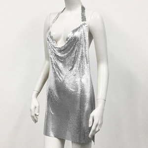 Detail of silver metallic mesh halter dress with cowl neck and sparkly sequin finish