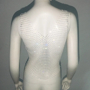Close-up of sparkling rhinestone mesh vest featuring back V-neck cut and tight elastic fit
