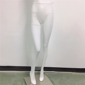 Detailed macro view of white mesh skirt with shimmering rhinestones for beachwear