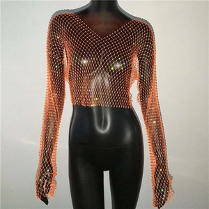 Detail of vibrant orange fishnet crop top featuring sparkling rhinestones and mesh texture