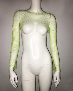 Detailed shot of neon green mesh shrug featuring sparkling rhinestones and long sleeves