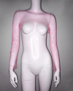 Detailed view of pink mesh shrug top with sparkling rhinestones on long sleeves