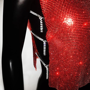 Detail of red rhinestone mesh top with silver crystal side chain decorations on mannequin