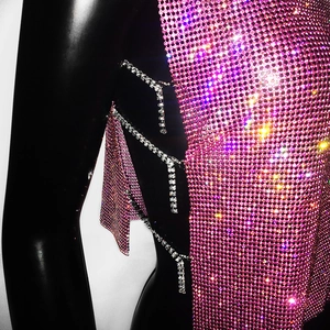Close-up of pink rhinestone mesh top with silver crystal side chain details