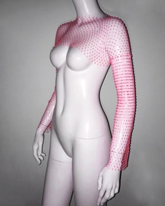 Detailed view of pink mesh shrug top featuring sparkling rhinestone embellishments and long sleeves