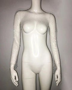 Detailed macro view of white mesh long sleeve bolero with sparkling rhinestone embellishments