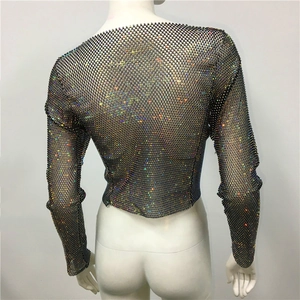 Close-up of black mesh crop top featuring vibrant iridescent AB rhinestones detail