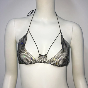 Detail of black mesh halter top featuring shimmering rhinestones and elastic tie straps