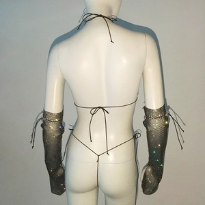 Detailed back view of sparkly rhinestone mesh sleeves and matching lace-up thong on mannequin