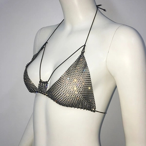 Detail of black rhinestone bikini top with sparkling mesh crystals and halter neck ties