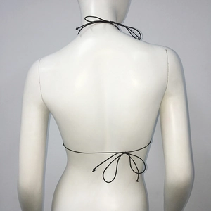Rear view of black halter bikini top with thin adjustable tie straps on white mannequin
