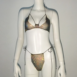Close-up of sparkling rhinestone mesh bikini set with adjustable side-tie details