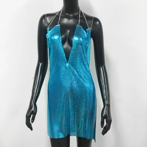 Detail of blue metallic mesh sequin dress featuring V-neckline and metal chain straps