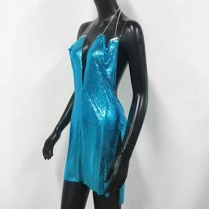 Detail of bright blue metallic sequin dress with deep V-neck and chain strap