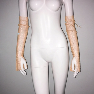 Detail of long champagne mesh sleeves with sparkling rhinestones and fingerless design