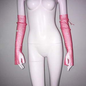 Detailed view of pink rhinestone fishnet long arm sleeves with thumb hole design