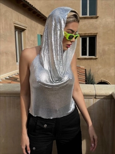 Detail view of silver metal sequin hooded halter top with shimmering mesh texture