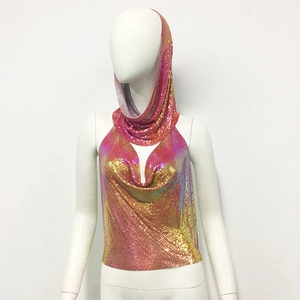 Detail of holographic metal mesh fabric on sequin halter top with integrated hood