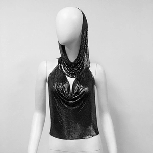 Close-up of black metallic sequin halter top and matching headscarf with chain mail texture