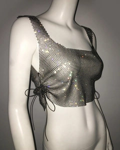 Detail view of silver rhinestone mesh crop top featuring adjustable black side drawstrings