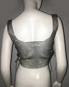 Detail of rhinestone mesh top featuring adjustable side lace-up and sparkling crystals