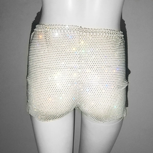 Macro detail of high waist drawstring shorts with sparkling rhinestone mesh patterns