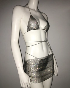 Detailed macro view of sparkling colorful rhinestones on a mesh bikini skirt set
