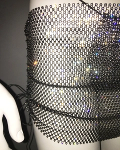Detail of black mesh bikini top with sparkling rhinestones and side lace-up design