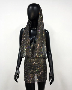 Detail of hooded halter dress featuring shimmering rhinestones and deep V-neck design