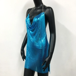 Detail of blue metallic sequin cowl neck dress with thin chain straps on mannequin