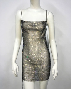 Close-up of sexy fishnet mini dress featuring colorful rhinestones and slim fit mesh