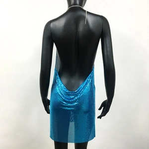 Close-up of bright blue sequin backless dress with silver metal halter neck chain