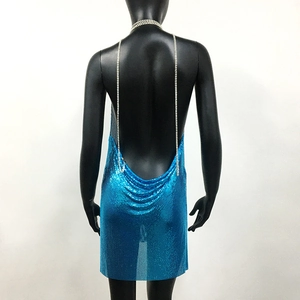 Detail of lake blue sequin mesh dress with backless design and thin crystal straps