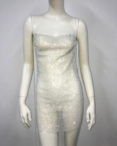 Detailed view of white rhinestone bodycon dress with shimmering crystal embellishments