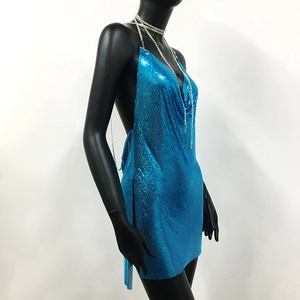 Detail of bright blue sequin metal mesh fabric with halter neck and side slit design