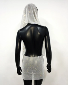 Macro detail of sparkly rhinestone mesh fabric and hooded silver party dress set