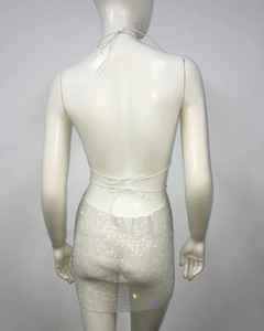 Macro detail of the back cross tie-up straps on this sparkly silver rhinestone mesh mini dress