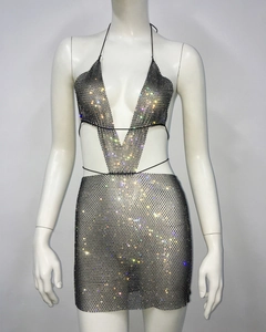 Detail view of sparkly rhinestone mesh crop top and matching mini skirt set for partywear
