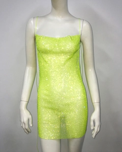 Close-up of neon green rhinestone mesh dress with thin straps and bodycon fit
