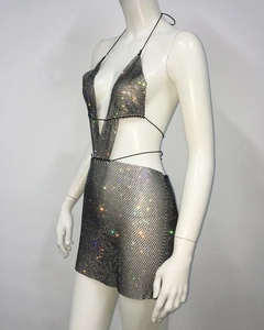 Detail of black mesh two-piece set featuring shimmering colorful rhinestones and ties
