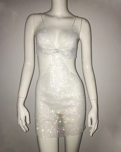 Macro shot of shimmering rhinestones and cut-out details on a sexy mesh party dress