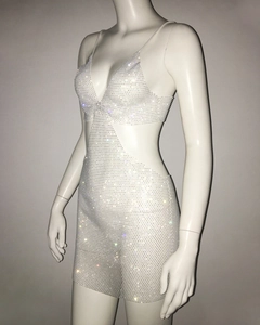 Detail view of the sexy silver rhinestone mini dress featuring a side cutout and slim fit