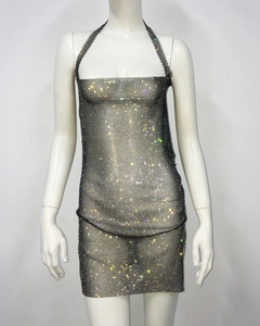 Detail of grey mesh halter top and mini skirt with shimmering colorful rhinestones