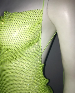 Detail of neon green rhinestone mesh tank top with sparkly gems and sheer fishnet fabric