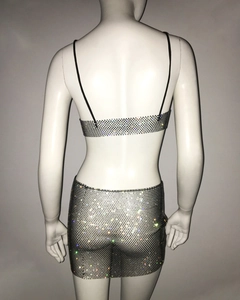 Rear view of sexy black rhinestone mesh crop top and mini skirt set on a model