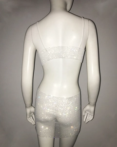 Detail of rhinestone fishnet two-piece party set showing backless design on mannequin